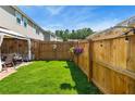 Spacious backyard featuring a well-maintained lawn, privacy fence, and a charming gazebo at 554 Rendevous Rd, Acworth, GA 30102