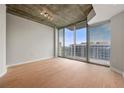 Bright, modern living room with hardwood floors and large windows that provides lots of natural light at 855 Peachtree Ne St # 3205, Atlanta, GA 30308