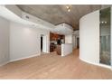 Open-concept living room and kitchen area with modern finishes and hardwood floors throughout at 855 Peachtree Ne St # 3205, Atlanta, GA 30308