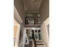 Grand foyer featuring soaring ceilings, a staircase with decorative iron railing, and views to the second floor at 2709 Ratby Ne Ln, Conyers, GA 30013