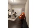 Bright office space with modern furnishings, including a sleek desk and comfortable seating for work or relaxation at 2709 Ratby Ne Ln, Conyers, GA 30013