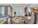 Spacious foyer with dark wood floors, arched doorways, and elegant decor at 3310 Vista Creek Dr, Dacula, GA 30019