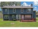 The backyard features a deck and ample green space, providing a perfect area for relaxation and entertainment at 2505 Se Tiffany Ct, Conyers, GA 30013