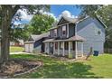 Beautiful two-story home featuring a covered porch, a two-car garage, and a lush green lawn at 2505 Se Tiffany Ct, Conyers, GA 30013