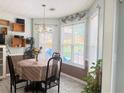 Cozy breakfast nook with bright windows and decorative accents for a charming ambiance at 3484 Lynley Mill Ln, Dacula, GA 30019