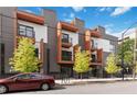 Modern townhome featuring sleek architectural design, balconies, and well-maintained landscaping at 367 Parkway Ne Dr # 3, Atlanta, GA 30312