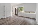 Bright living room featuring sleek flooring, ample natural light, and modern doors at 367 Parkway Ne Dr # 3, Atlanta, GA 30312