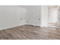 A well-lit living room showcasing laminate flooring, neutral decor, and modern doors at 367 Parkway Ne Dr # 3, Atlanta, GA 30312