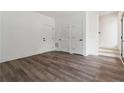 Bright living area featuring hardwood floors, modern trim and three doors at 367 Parkway Ne Dr # 3, Atlanta, GA 30312
