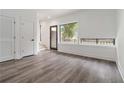 Bright living area featuring hardwood floors, modern trim and a large window at 367 Parkway Ne Dr # 3, Atlanta, GA 30312