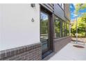 Welcoming entry with modern door, brick foundation, and ample natural light at 367 Parkway Ne Dr # 6, Atlanta, GA 30312