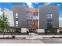 Modern townhome exterior featuring gray siding, balconies, and well-maintained landscaping at 367 Parkway Ne Dr # 6, Atlanta, GA 30312