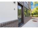 Close up view of unit #6, with many large windows and brick accents at 367 Parkway Ne Dr # 6, Atlanta, GA 30312