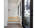 Entryway with hardwood floors, leading up to a staircase and featuring a front door and a window at 367 Parkway Ne Dr # 9, Atlanta, GA 30312