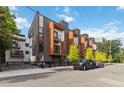 Modern townhome exterior featuring a combination of gray siding, balconies, and professional landscaping at 367 Parkway Ne Dr # 9, Atlanta, GA 30312