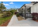Charming front porch with decorative railing, providing a welcoming entrance and enhanced curb appeal at 2014 Fence Rd, Dacula, GA 30019