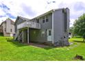 Exterior photo of backyard with a small deck and stairs at 4090 Mark Todd Ct, Hoschton, GA 30548