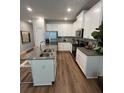 Modern kitchen featuring white cabinets, granite counters, and stainless steel appliances at 4261 Notting Hill Sw Dr, Atlanta, GA 30331