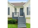 Inviting front porch featuring painted steps and railing leading to the main entrance at 7434 Chads Cir, Jonesboro, GA 30236