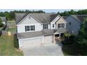 Attractive two-story home with a two-car garage and well-maintained landscaping at 9120 Alden Dr, Locust Grove, GA 30248