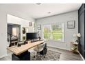 Bright home office with view of front yard, light colored walls, and modern furnishings at 100 Chadwick Pl, Villa Rica, GA 30180