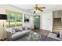Inviting living room with lots of natural light, neutral furniture, and a cozy ambiance at 320 Edna Dr, Stockbridge, GA 30281