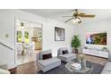 Comfortable living room open to kitchen, with modern decor, seating, and bright ambiance at 320 Edna Dr, Stockbridge, GA 30281