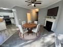Cozy dining area featuring a fireplace and adjacent kitchen with modern appliances at 2572 Laurel Cir, Atlanta, GA 30311