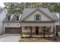 Charming two-story home with a two-car garage and inviting front porch in a desirable neighborhood at 3007 Holly St, Canton, GA 30115