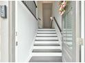 A view of the entryway with white and dark wood stairs at 1122 Provence Ln, Decatur, GA 30033