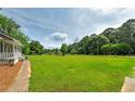 Expansive front yard offering ample space and scenic views at 1810 King Mill Rd, Mcdonough, GA 30252
