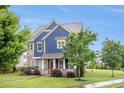 Beautiful two-story home boasts lush landscaping, stone accents, and a welcoming front porch at 1946 Jeffery Nw Rd, Atlanta, GA 30318