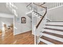 Inviting foyer with hardwood floors and a staircase, creating a warm welcome at 361 Sarah Ln, Lawrenceville, GA 30046