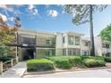Inviting condo with covered parking, balcony, and a lovely screened-in porch at 2015 Wingate Way, Atlanta, GA 30350