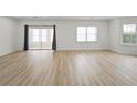 Bright living room features sliding doors and a large window, providing ample natural light and access to an outdoor space at 3649 Peachtree Ne Rd # 305, Atlanta, GA 30319