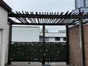 Cozy patio featuring a wooden pergola, privacy greenery, and a modern design at 3649 Peachtree Ne Rd # 305, Atlanta, GA 30319