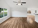 Bright living room featuring hardwood floors and vaulted ceilings, bathed in natural light at 6795 Browns Mill Walk, Lithonia, GA 30038