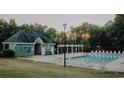 Community swimming pool offers a refreshing retreat with ample seating for relaxation and social gatherings at 1090 Crown River Pkwy, Mcdonough, GA 30252