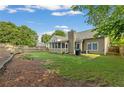 Spacious backyard with a screened porch and fenced-in yard at 1615 Nw Vinebrook Nw Ter, Kennesaw, GA 30144