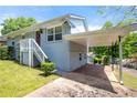 Single Gathering home exterior view shows front entrance stairs and convenient covered parking at 1985 Thomasville Se Dr, Atlanta, GA 30315