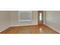Inviting living area showcasing sleek hardwood floors, a bright window and a stylish front door at 200 Compton Ct, Mcdonough, GA 30252