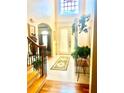 Bright foyer with tile flooring, high ceilings, and a decorative rug leading to the front door at 5430 Lemoyne Sw Dr, Atlanta, GA 30331