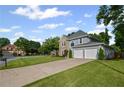 Well-maintained home with a long driveway, attached two car garage, and manicured lawn at 2261 Seatton Ct, Marietta, GA 30062