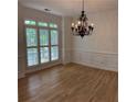 Bright dining room with natural light, hardwood floors, and decorative chandelier at 753 Hayes Ct, Atlanta, GA 30349