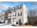 Attractive townhome with neutral siding, green shutters, and an attached one car garage at 805 Abbotts Mill Ct # 74, Duluth, GA 30097