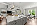 Bright kitchen with a large center island, quartz countertops, and stainless steel appliances at 1104 Victoria Ne St, Brookhaven, GA 30319