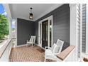 Cozy porch with rocking chairs, showcasing classic design and peaceful outdoor seating at 1104 Victoria Ne St, Brookhaven, GA 30319