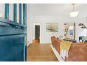 Welcoming foyer with a wooden front door leading into the home's open living spaces at 1231 Mansfield Ne Ave, Atlanta, GA 30307