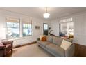 Spacious living room with beautiful hardwood floors, neutral paint, and an abundance of natural light at 1231 Mansfield Ne Ave, Atlanta, GA 30307