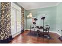 Bonus room with hardwood floors, large window, and an electronic drum set at 2015 Towne Lake W Hls, Woodstock, GA 30189